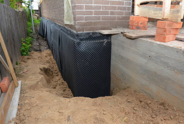 SJ Waterproofing Pros technician performing targeted Vapor Barrier Installation assessment in King, WI